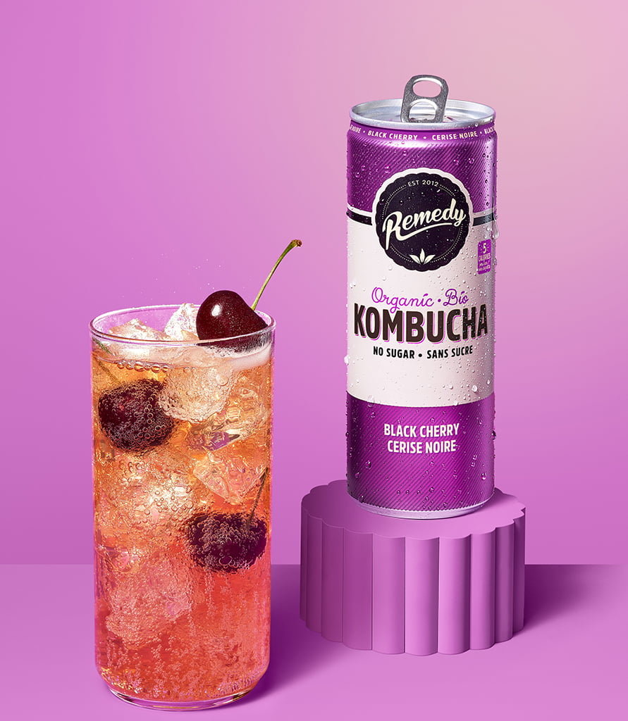 Remedy Black Cherry Kombucha Can with Glass full of Kombucha Lifestyle