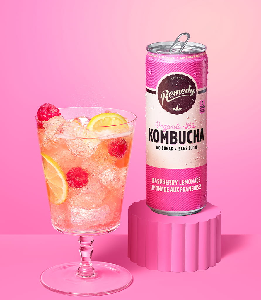 Remedy Raspberry Lemonade Kombucha Can with Glass full of Kombucha Lifestyle