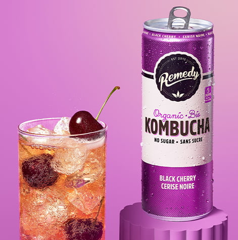 Remedy Black Cherry Kombucha Can with Glass full of Kombucha