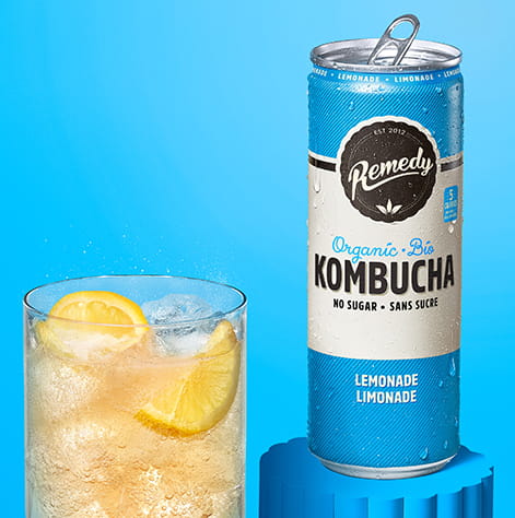 Remedy Lemonade Kombucha Can with Glass full of Kombucha