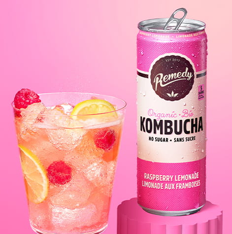 Remedy Raspberry Lemonade Kombucha Can with Glass full of Kombucha