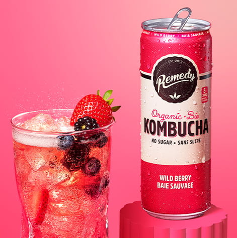 Remedy Wild Berry Kombucha Can with Glass full of Kombucha